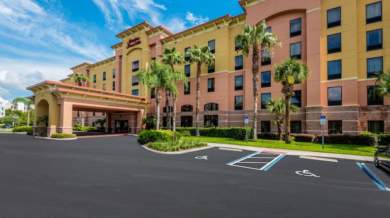 Hotel Exterior and Parking Lot During Day