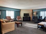 Junior Suite with Bed, Lounge Seating, Table and Television