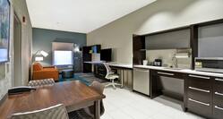 Suite Living and Kitchen Area with Stainless Steel Appliances