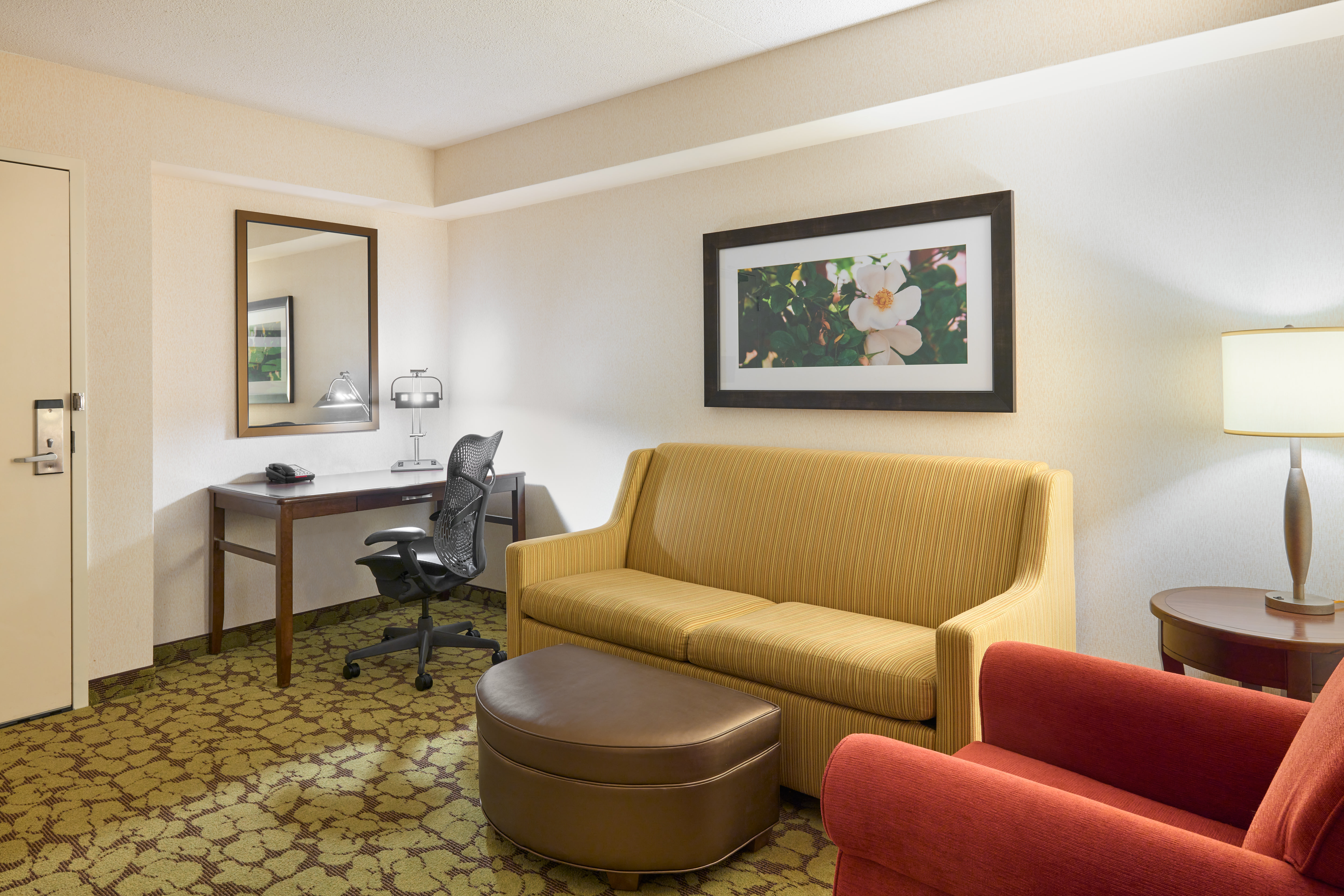 lounge and desk area in suite