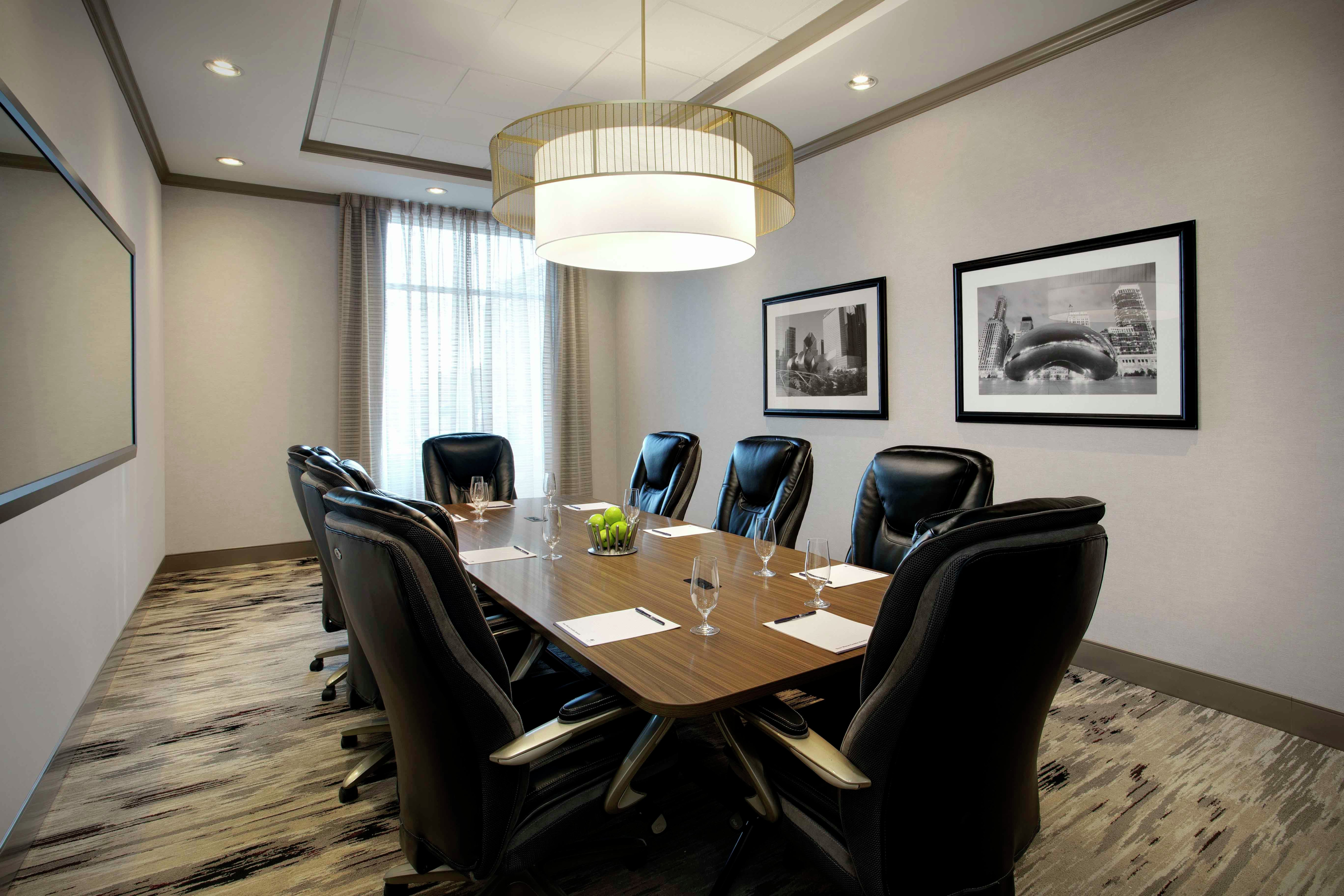 a boardroom table and chairs in a meeting room