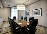 a boardroom table and chairs in a meeting room