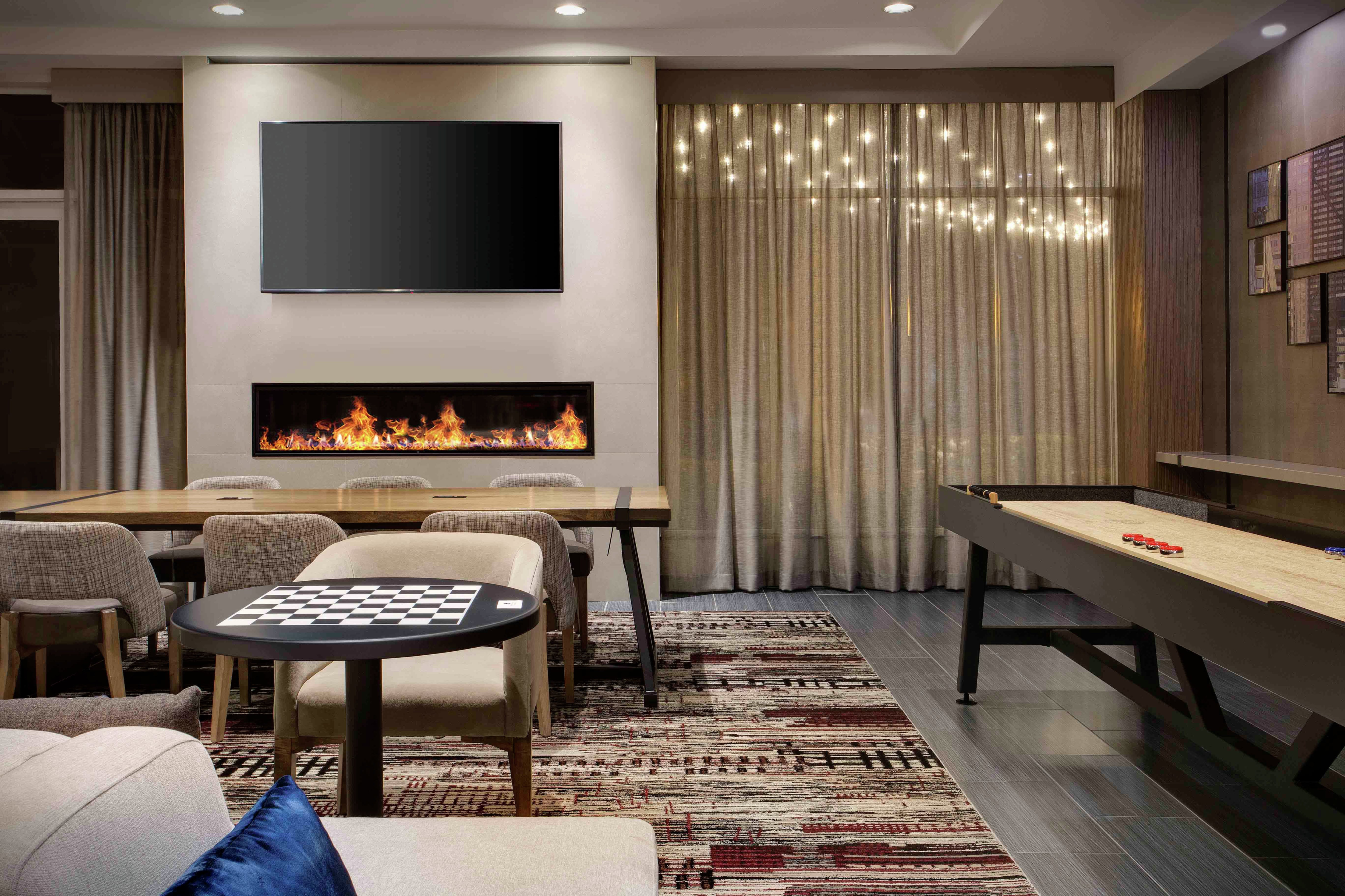 a lobby seating area with a fireplace