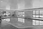 indoor pool area with windows 