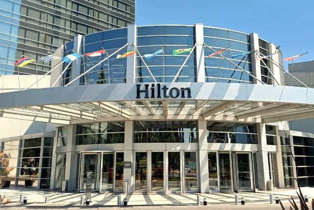 Hilton Hotel Exterior Entrance with Flags