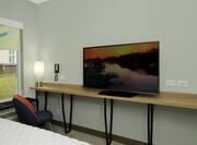 Guest Room with Light Natural Wood Wall-length Table with Iron Legs, TV and Working Space  