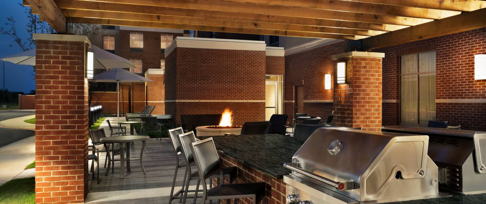 Outdoor BBQ Grill Area at Night