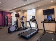 Fitness Center with HDTVs Treadmills and Elliptical Machine