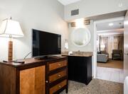 Suite Bedroom with Television, Wet Bar and Entry to Living Room