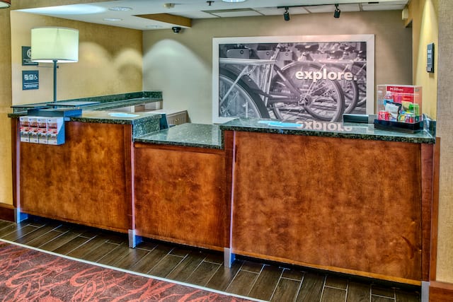 Reception Desk Area With Lamp and Wall Art