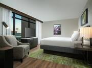 King Guestroom Suite with Bed, Lounge Area, and Room Technology