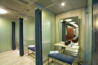 Modern Spa Cubicles with Wooden Floors and Large Mirrors