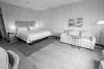 Bed and couch in guest room