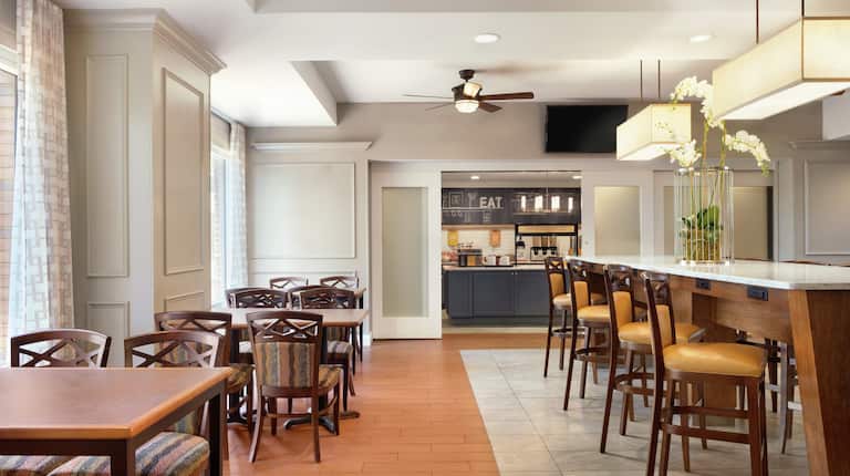 Spacious breakfast area featuring complimentary daily buffet and ample comfortable seating.