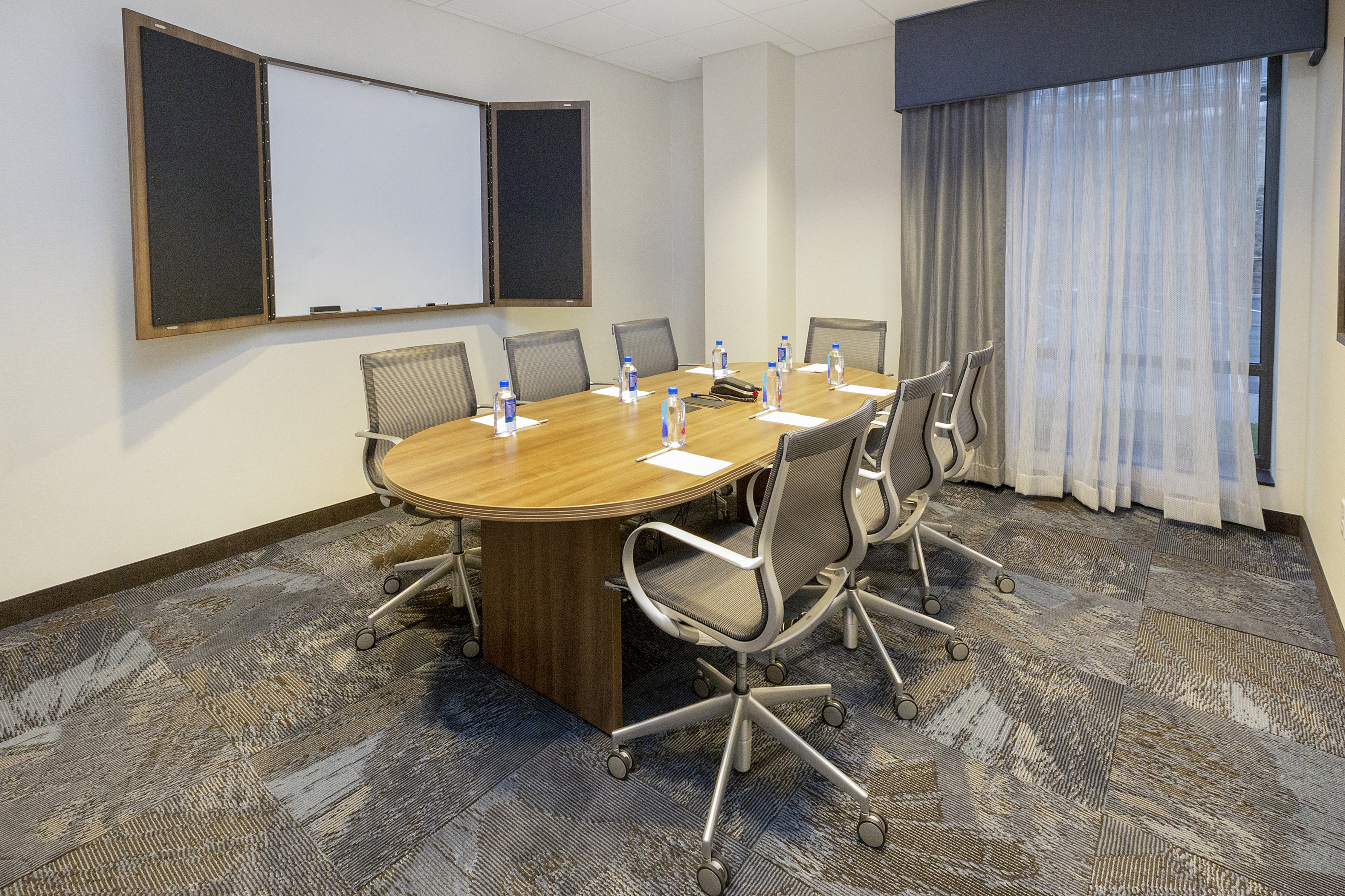 Boardroom with Meeting Table, Office Chairs and Whiteboard