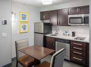 Double Queen Suite Kitchen with Dining Area and Room Technology