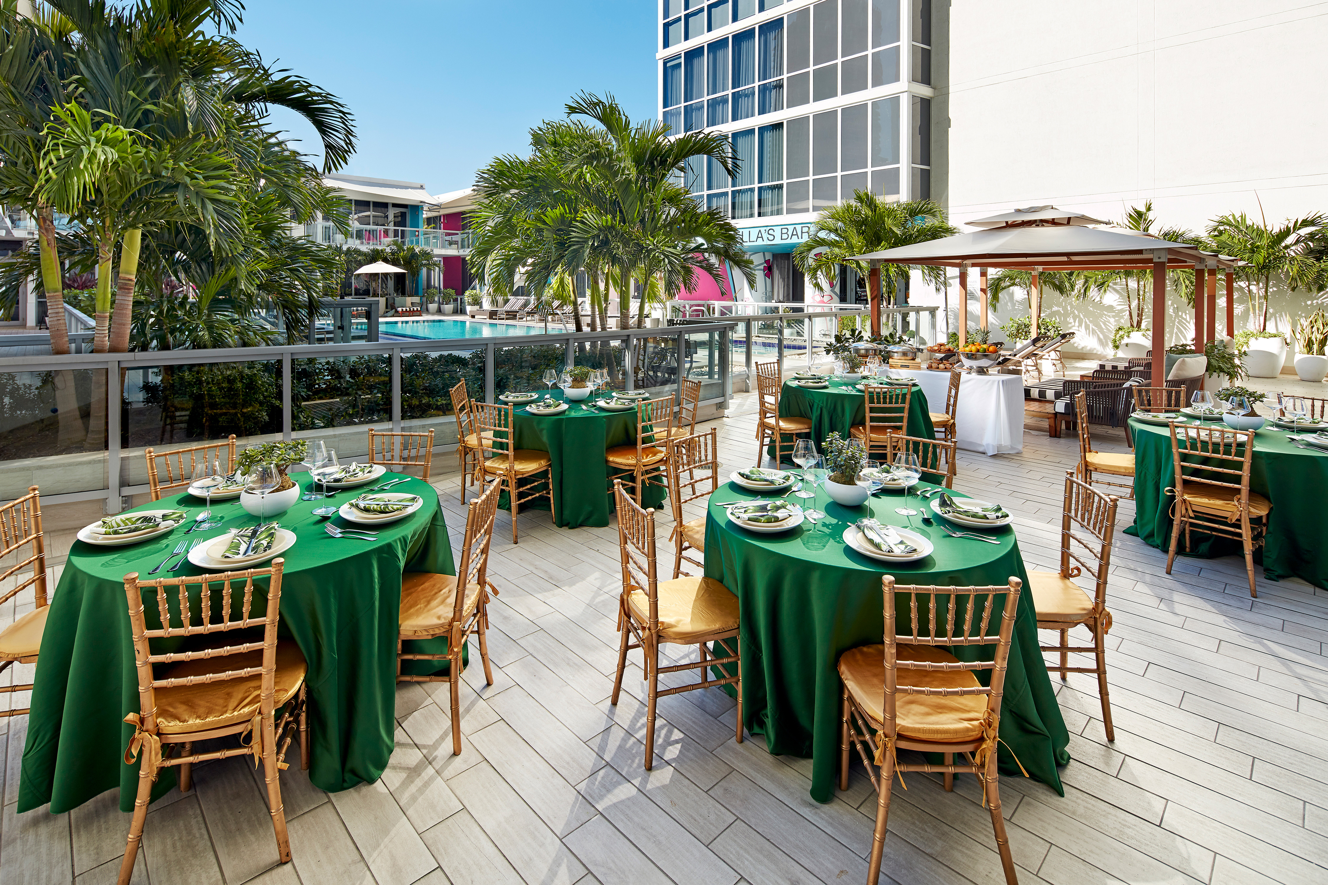 Exterior Poolside Dining Area with Round Banquet Tables and Chairs