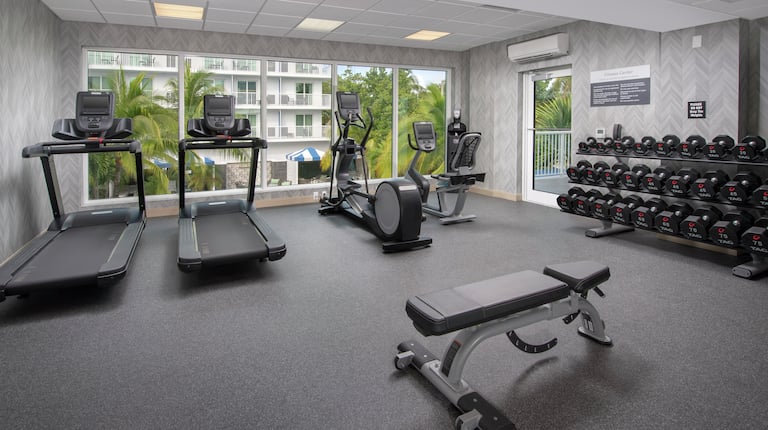 Fitness center filled with exercising equipment 