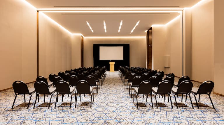 Rows of Chairs in Yucatan Ballroom Facing Podium and Presentation Screen