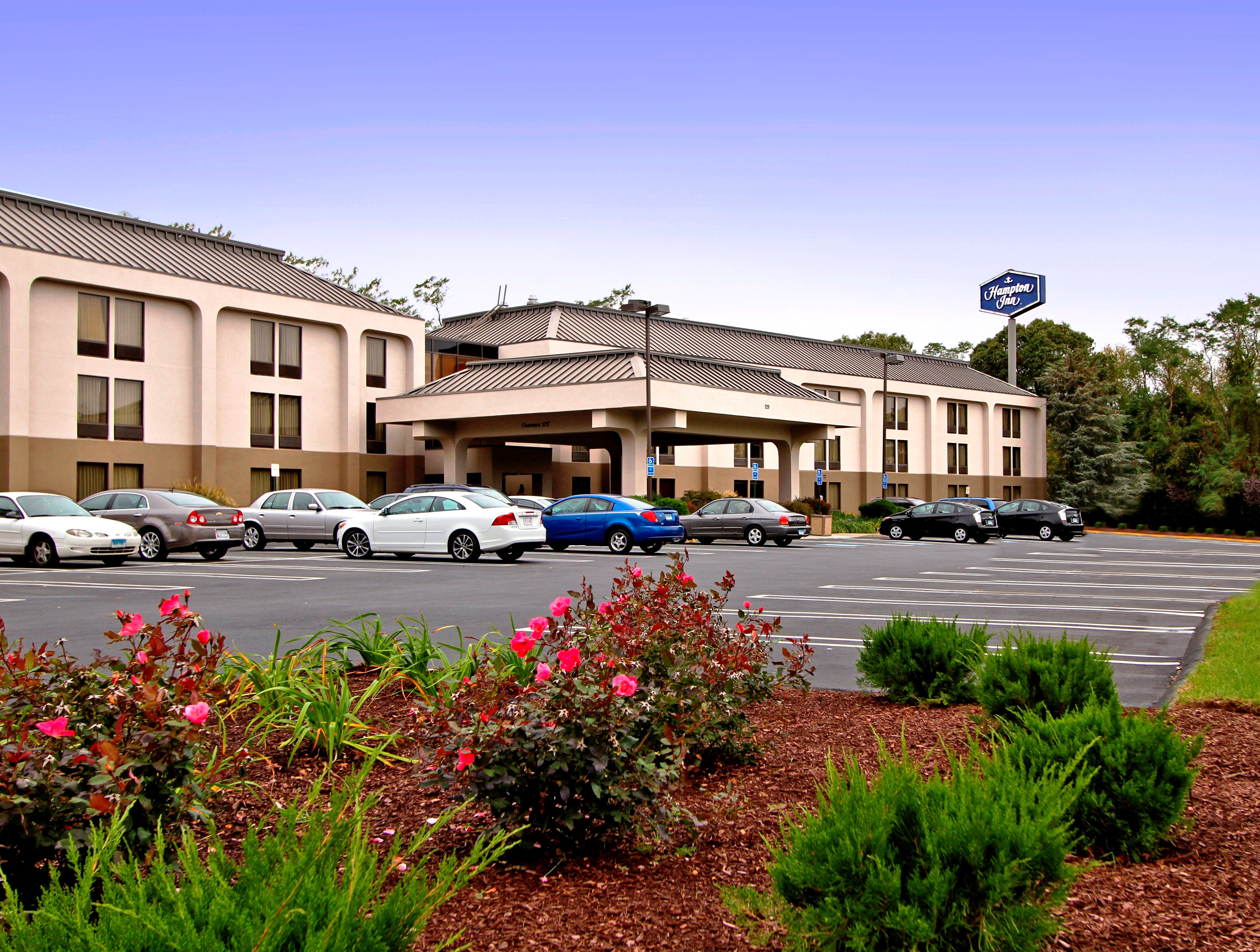 outside image of hotel with cars