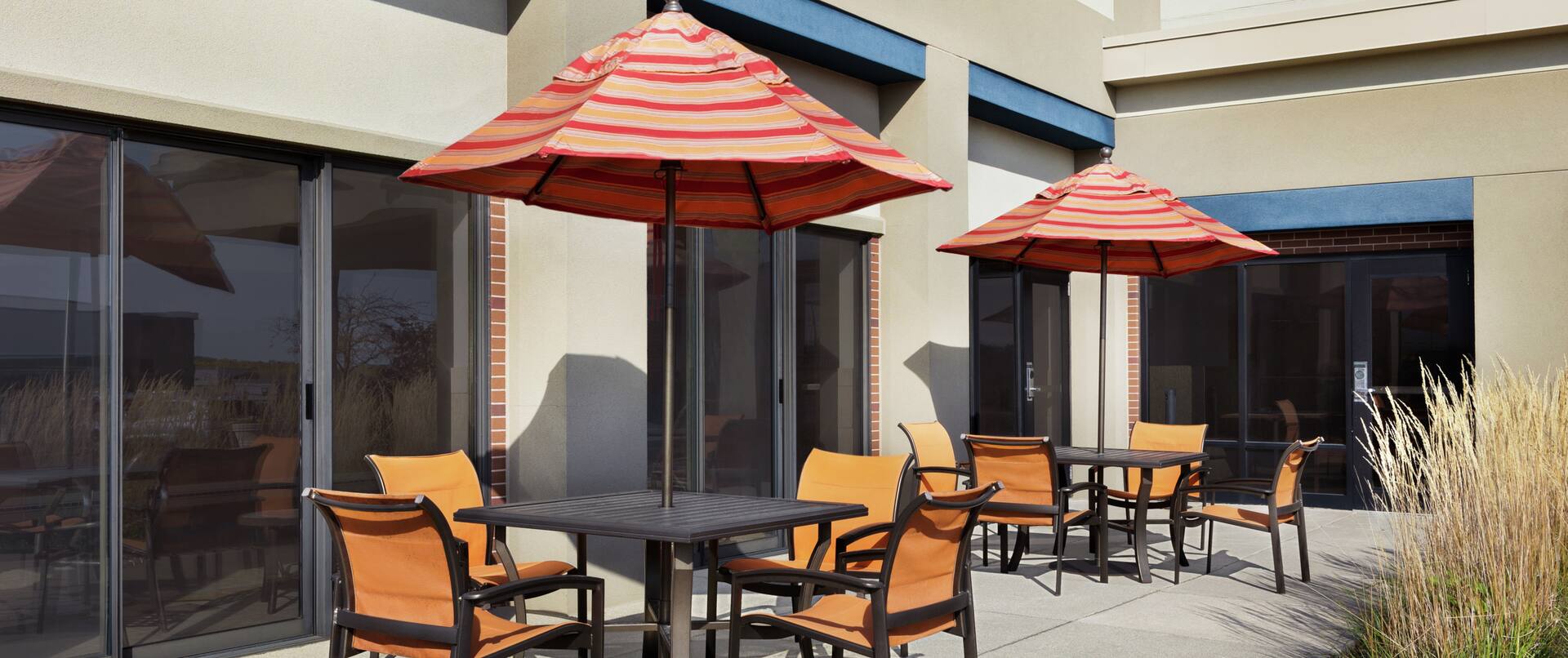 Spacious outdoor patio featuring tables with ample seating.