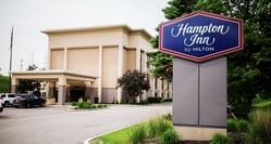 Hampton Inn Hotel Exterior with Curbside Sign