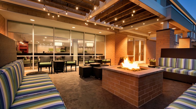 Outdoor Patio Area with Firepit at Night