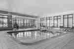 Pool area with hot tub area in he background