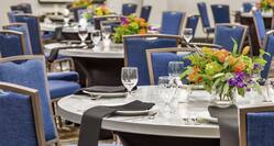 Convenient on-site large meeting room featuring beautiful banquet setup.