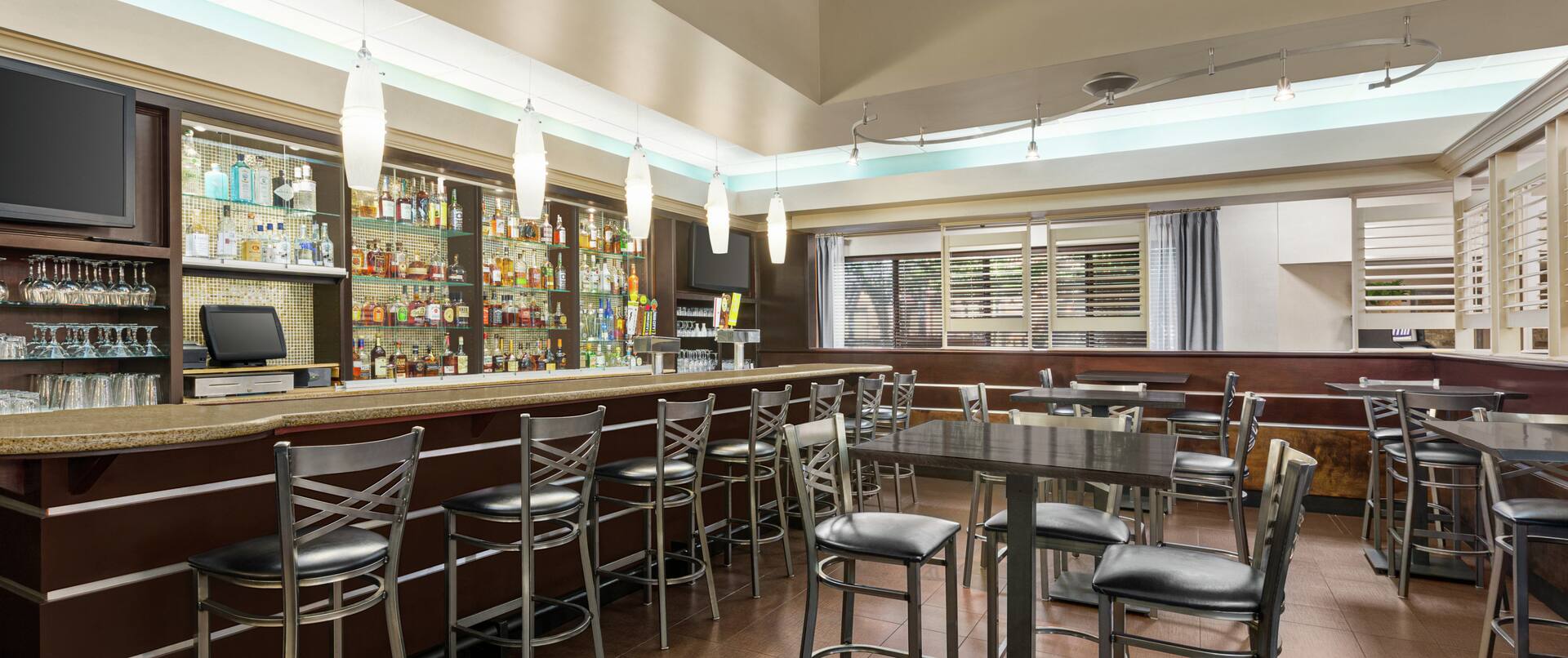 Spacious on-site restaurant featuring large bar and ample seating.