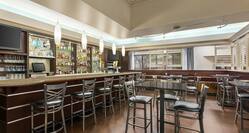 Spacious on-site restaurant featuring large bar and ample seating.
