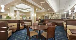 Spacious on-site restaurant with ample seating and welcoming atmosphere.