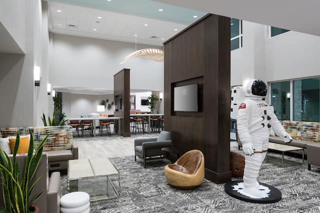 Statue of Man Wearing a NASA Suit in Lobby Area