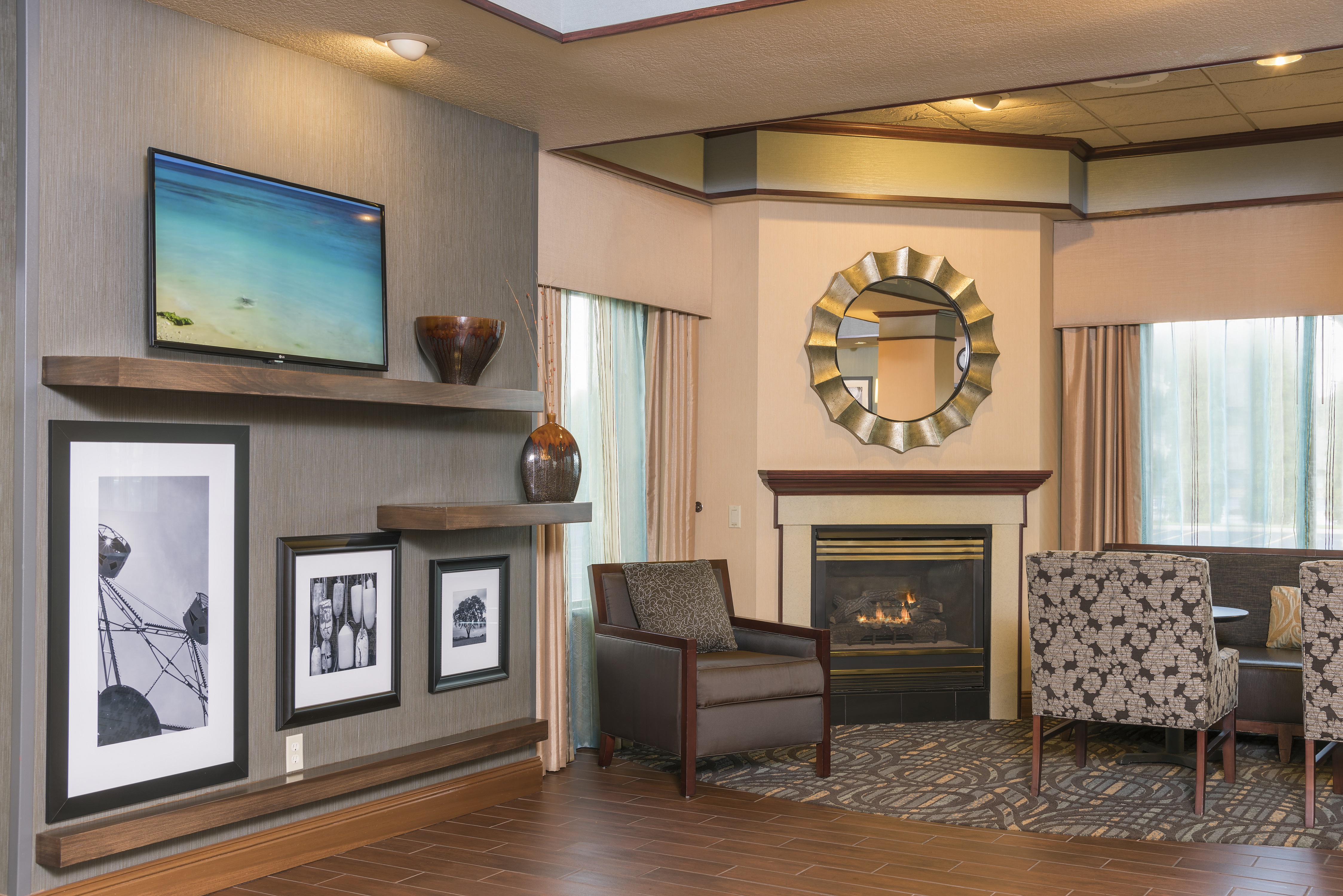 Lobby Seating Area with Seats, Wall Mounted HDTV and Fireplace