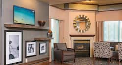 Lobby Seating Area with Seats, Wall Mounted HDTV and Fireplace