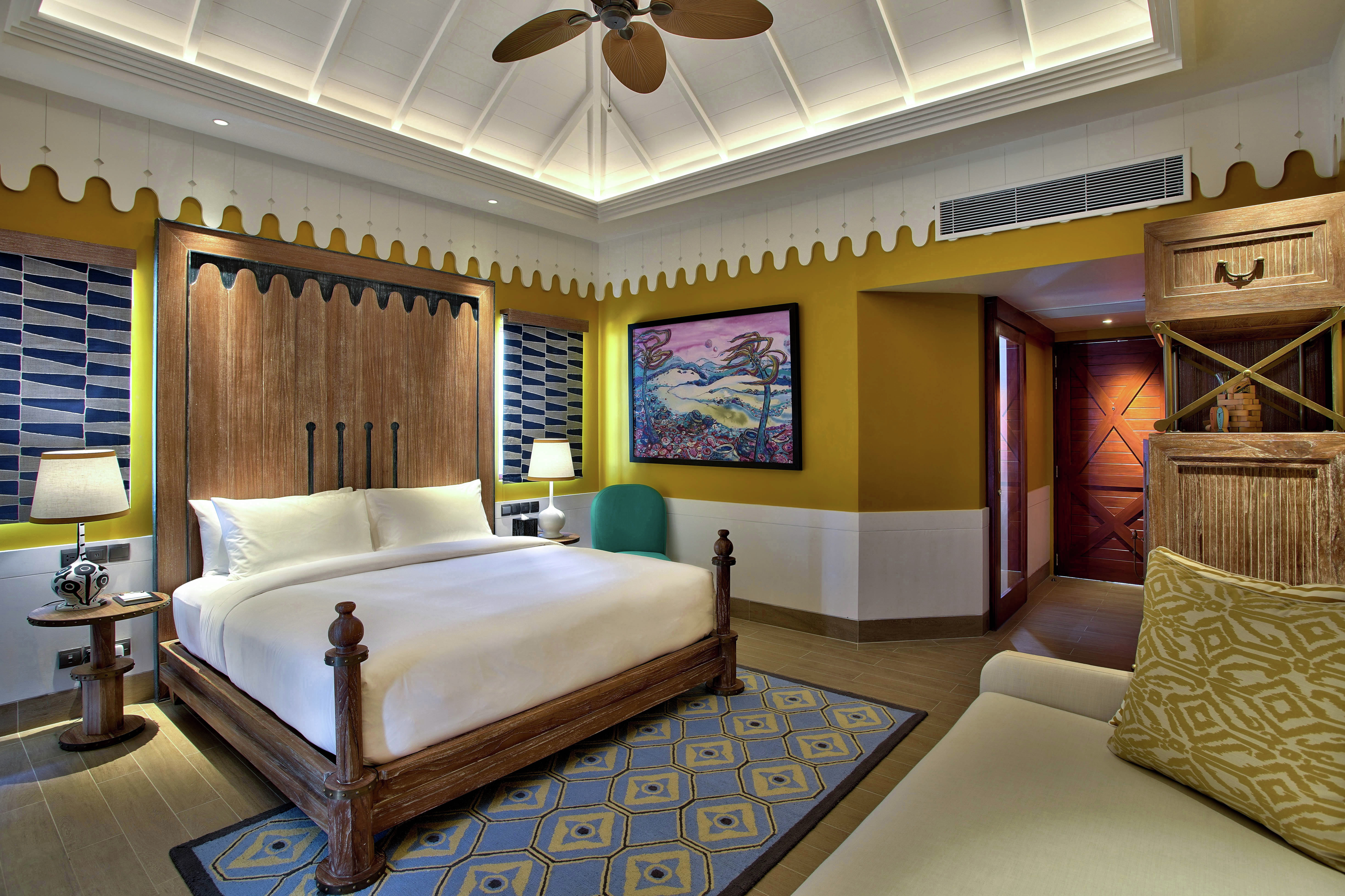 Beach Villa Bedroom with Bed and Lounge Area