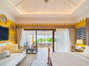 King Beach Villa Bed view with outdoor balcony and sofa