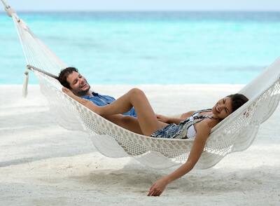 Couple laying on a hammock