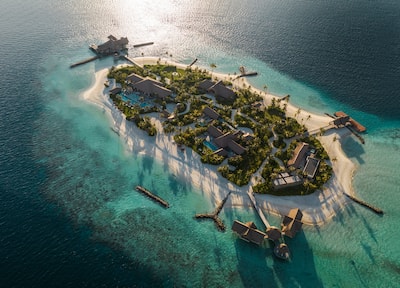 Private island with trees and buildings