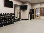 Fitness Center with weights and 2 TVs