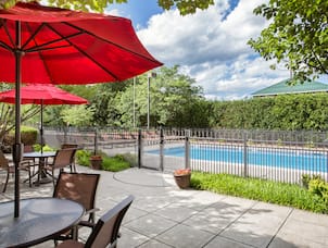 Hampton Inn Middletown Hotel, NY - Patio with Seating and View of Pool