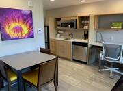 Work Desk, Ergonomic Chair, Kitchen, and Dining Table with Chairs in King One-Bedroom Suite