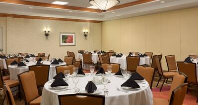 Ballroom Dining Area with Round Tables and Chairs