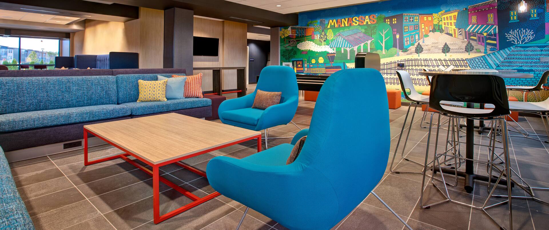 lobby seating area with mural 