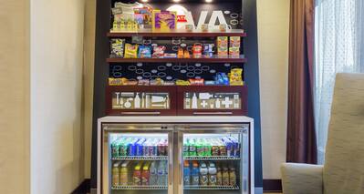 Snack Shop with Convenience Items on Shelves and in a Cooler