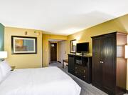 Guestroom with Queen Bed, Mini Fridge, Microwave and Television