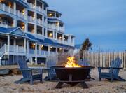 Hotel exterior with fire pit on beach