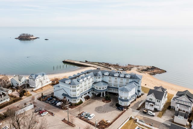 Hotel exterior from above, with sea view