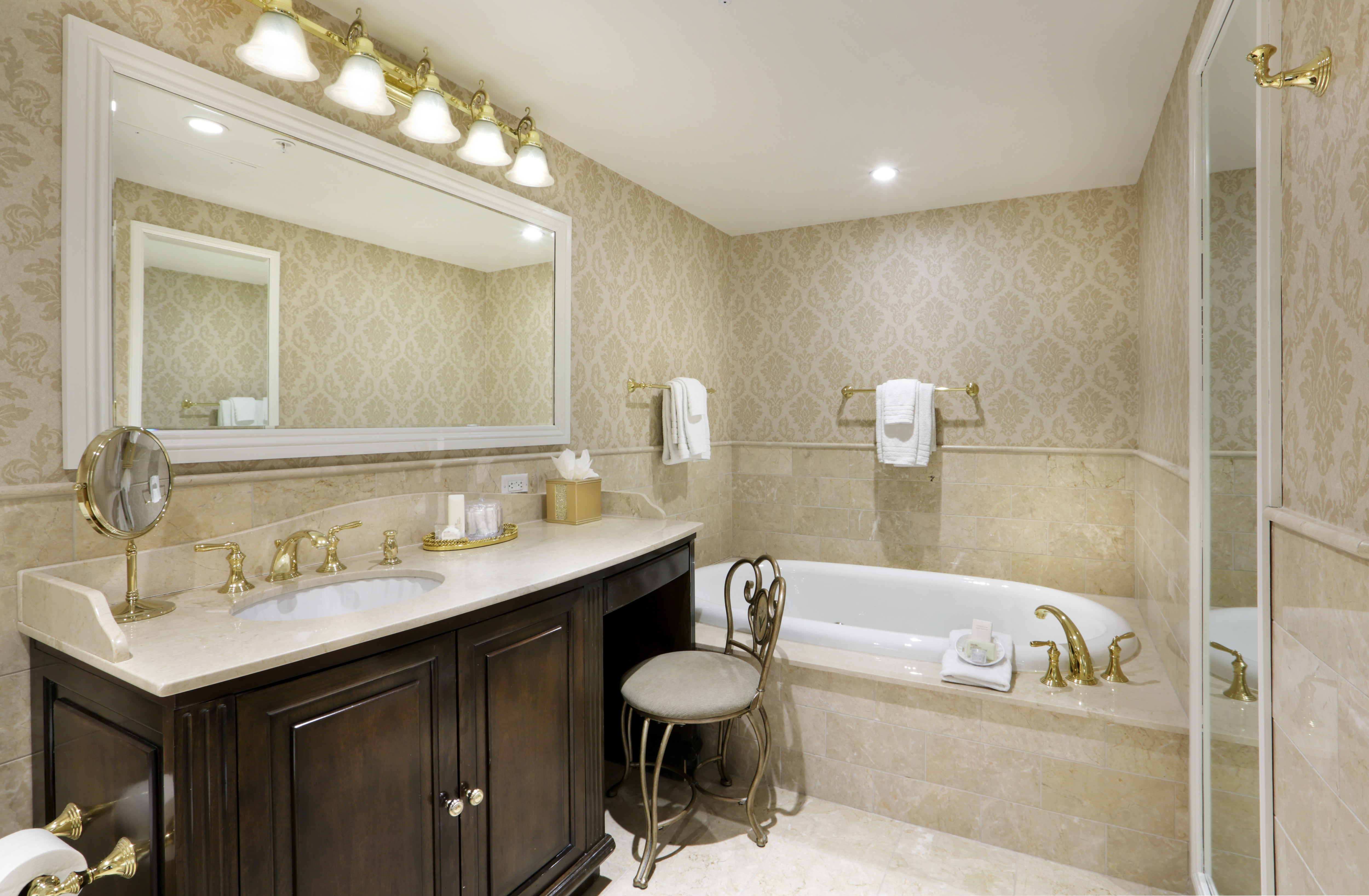 Two Bedroom Suite Bathroom with Tub and Vanity Area with Large Mirror
