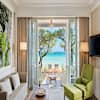 Living Area and Beach View of a Deluxe Beachfront Suite